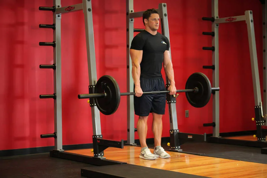 Barbell shrug: start and finish positions