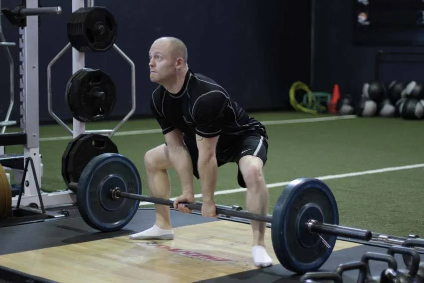 Barbell sumo deadlift: start and finish positions