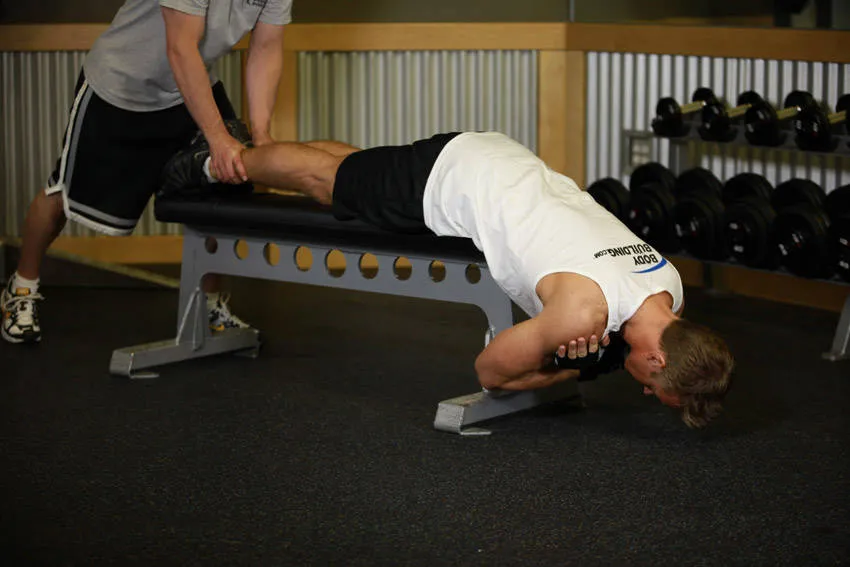 Bench hyperextension: start and finish positions