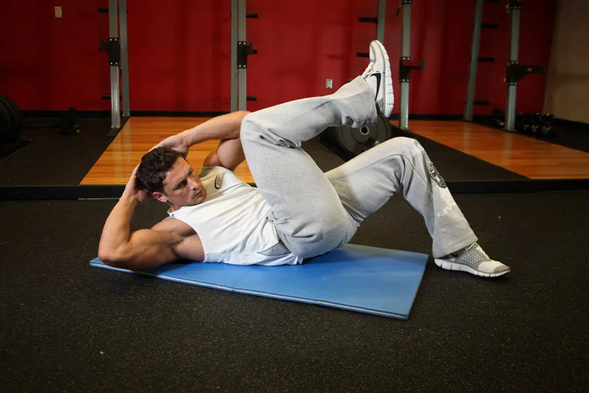 Cross-body crunch: start and finish positions