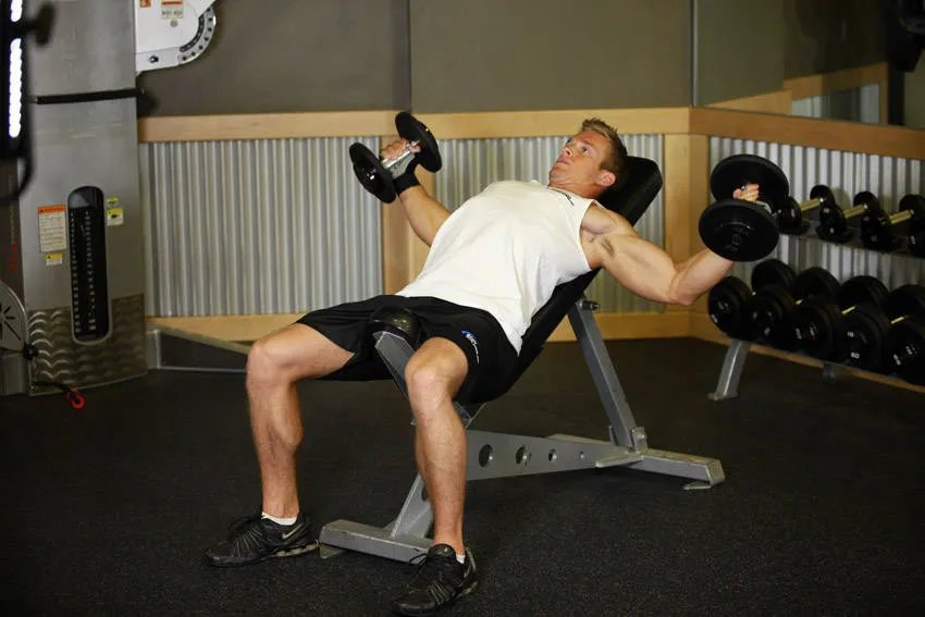 Incline dumbbell fly: start and finish positions