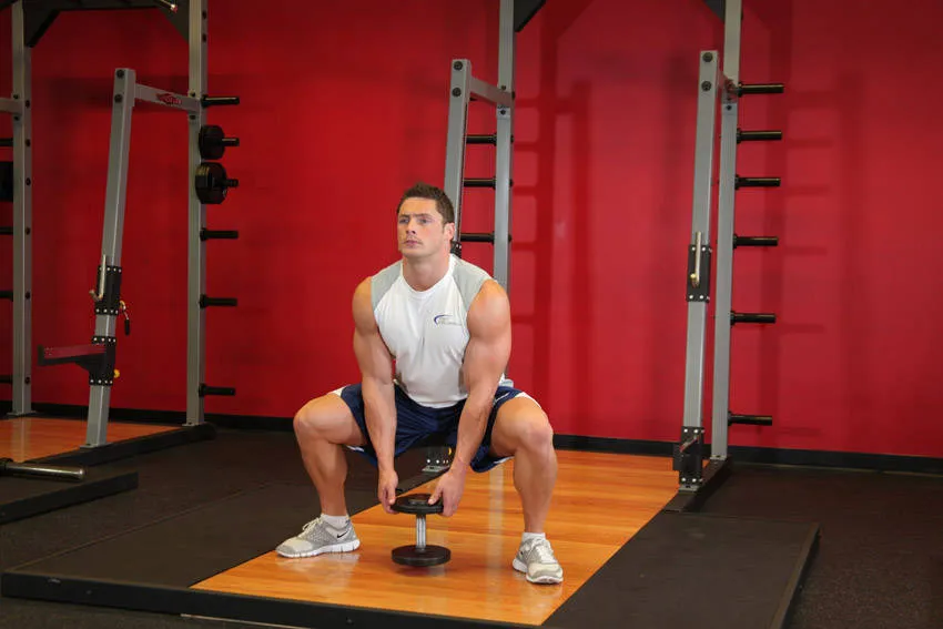 Plie dumbbell squat: start and finish positions