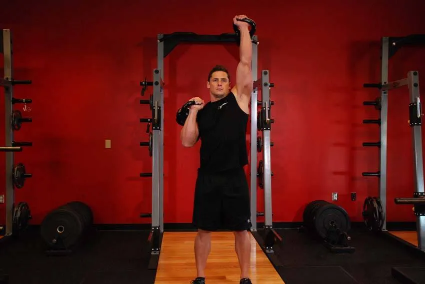 Alternating kettlebell press: start and finish positions