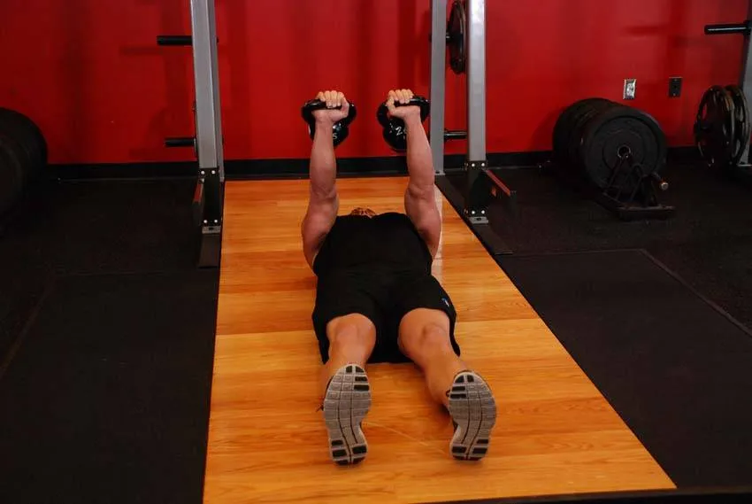 Kettlebell floor press: start and finish positions