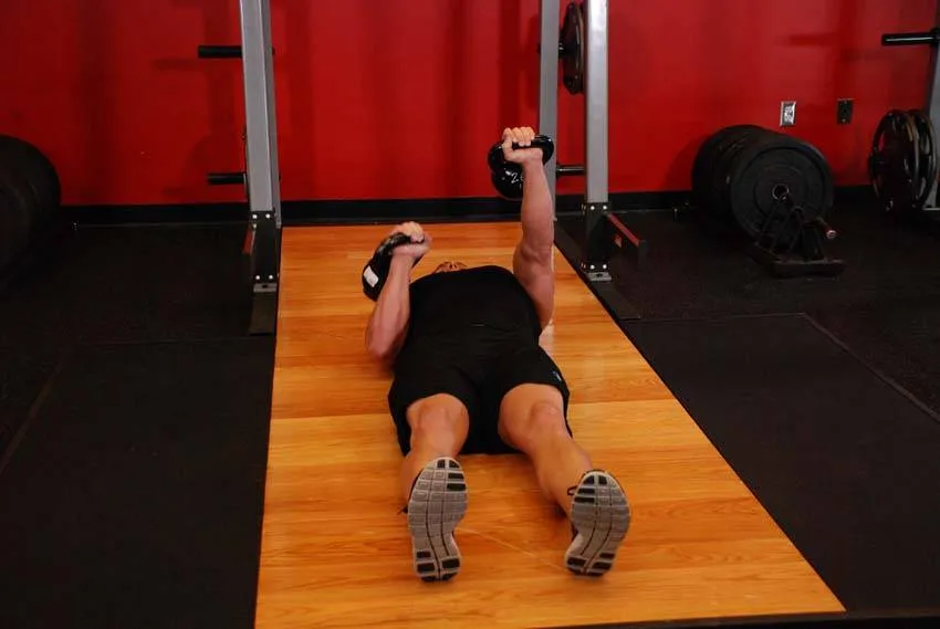 Kettlebell floor press: start and finish positions