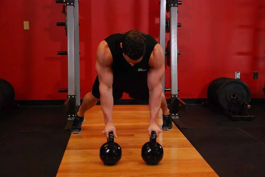 Kettlebell renegade row: start and finish positions