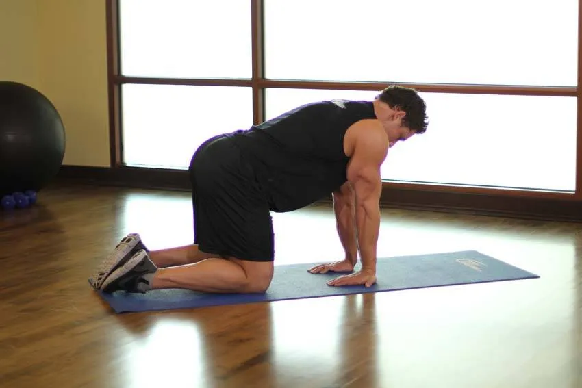 Kneeling forearm stretch: start and finish positions