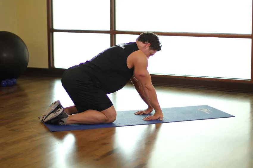 Kneeling forearm stretch: start and finish positions