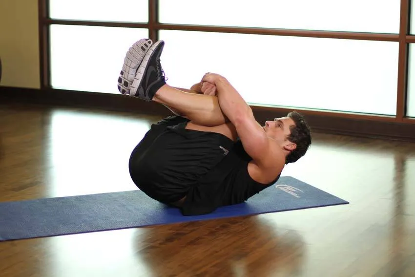 Knees to chest: start and finish positions