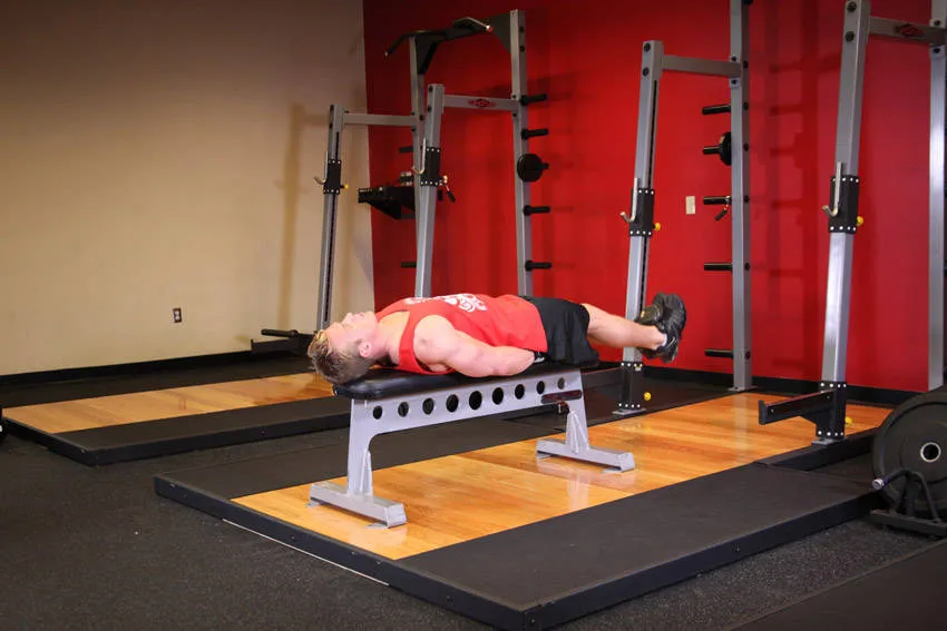 Lying leg raise: start and finish positions