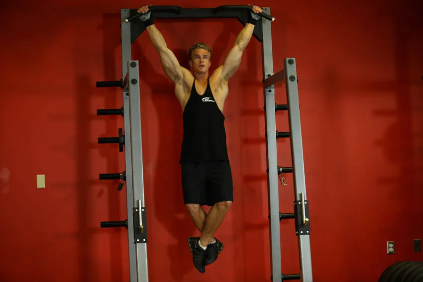 Wide-grip rear pull-up: start and finish positions