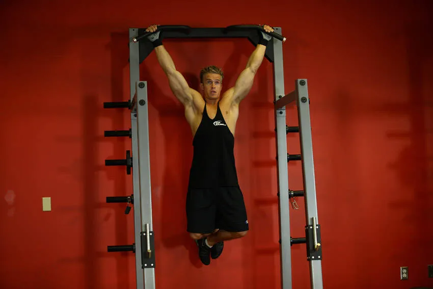 Wide-grip rear pull-up: start and finish positions