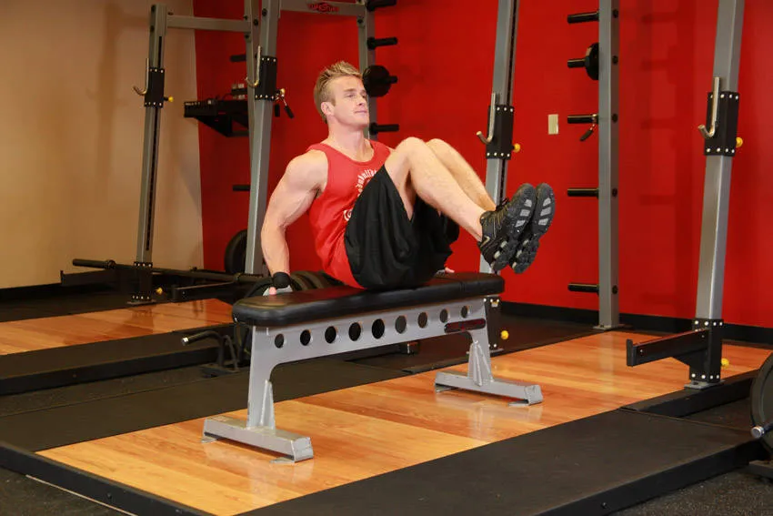 Seated leg tucks: start and finish positions