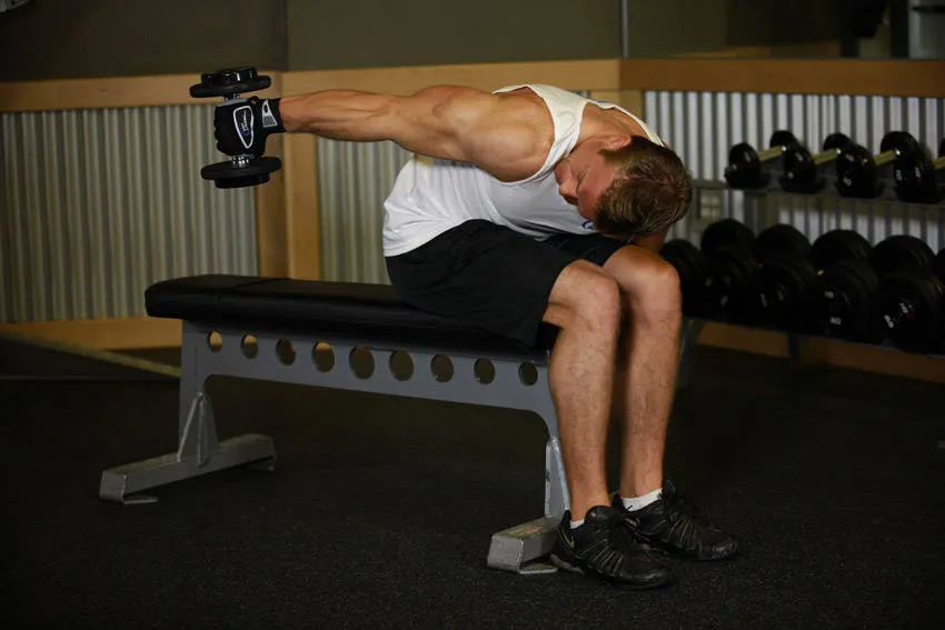 Seated one-arm triceps extension: start and finish positions